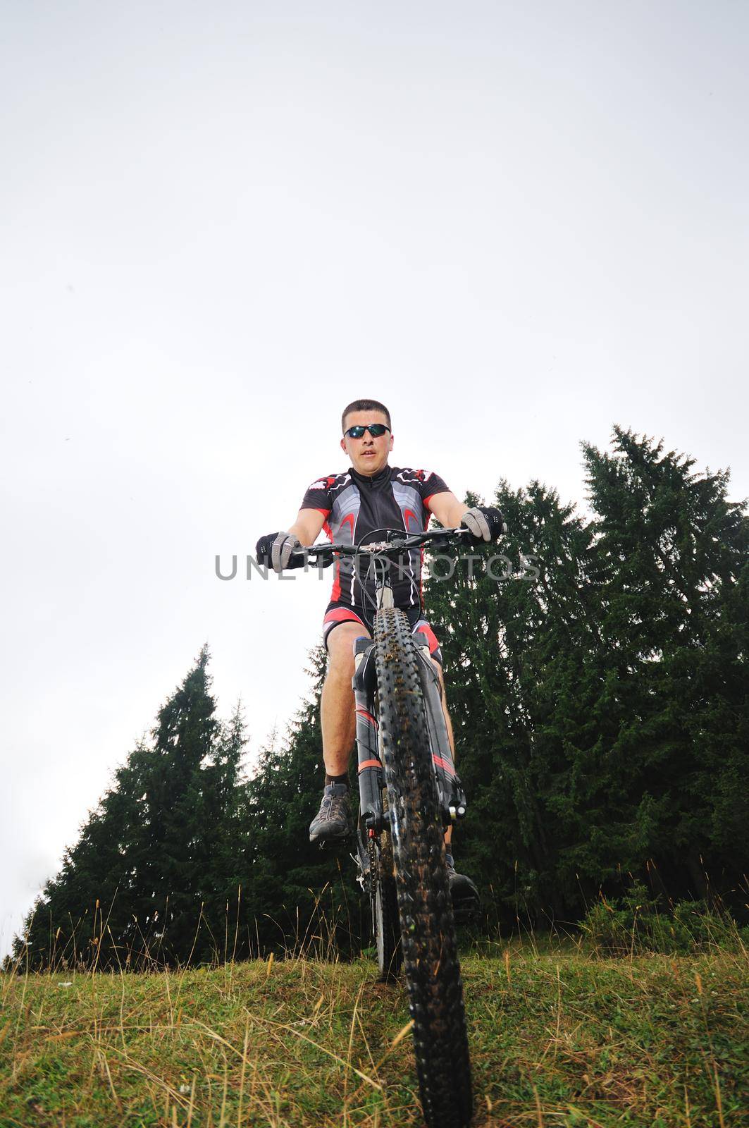 healthy lifestyle and fitness concept with mount bike man outdoor