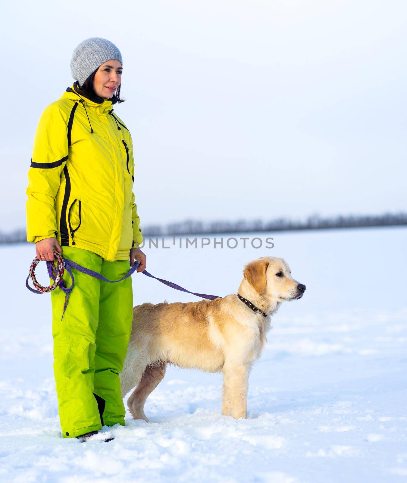 Woman with dog walking by GekaSkr