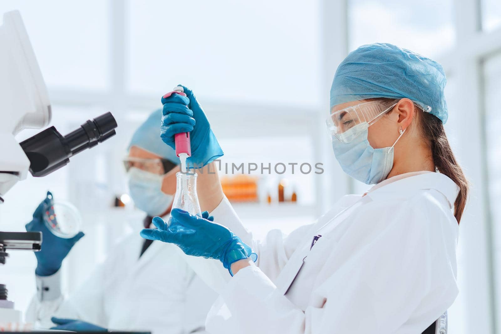 close up. laboratory staff is testing the new vaccine. science and health.