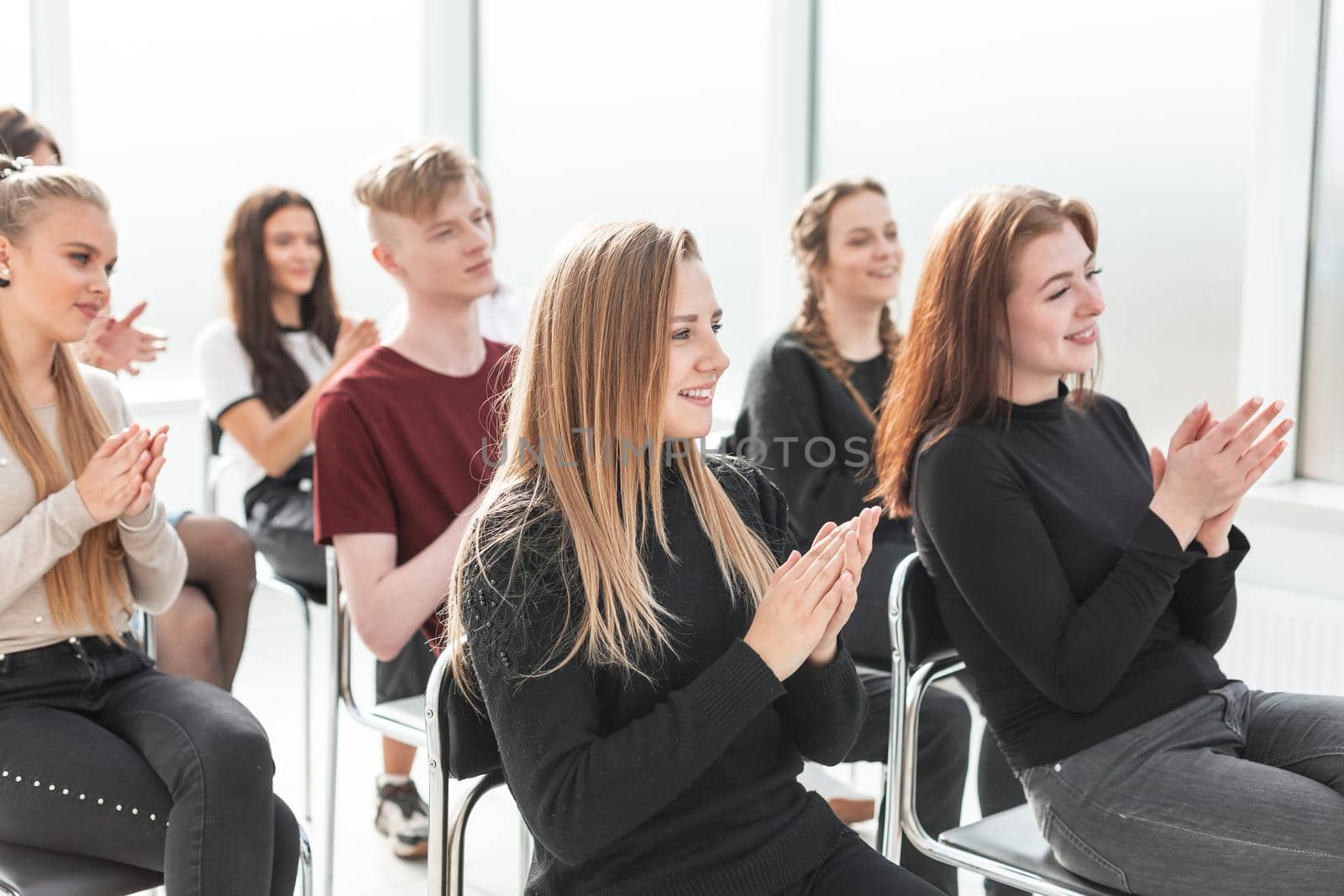 working group of young professionals sitting in the conference room by SmartPhotoLab