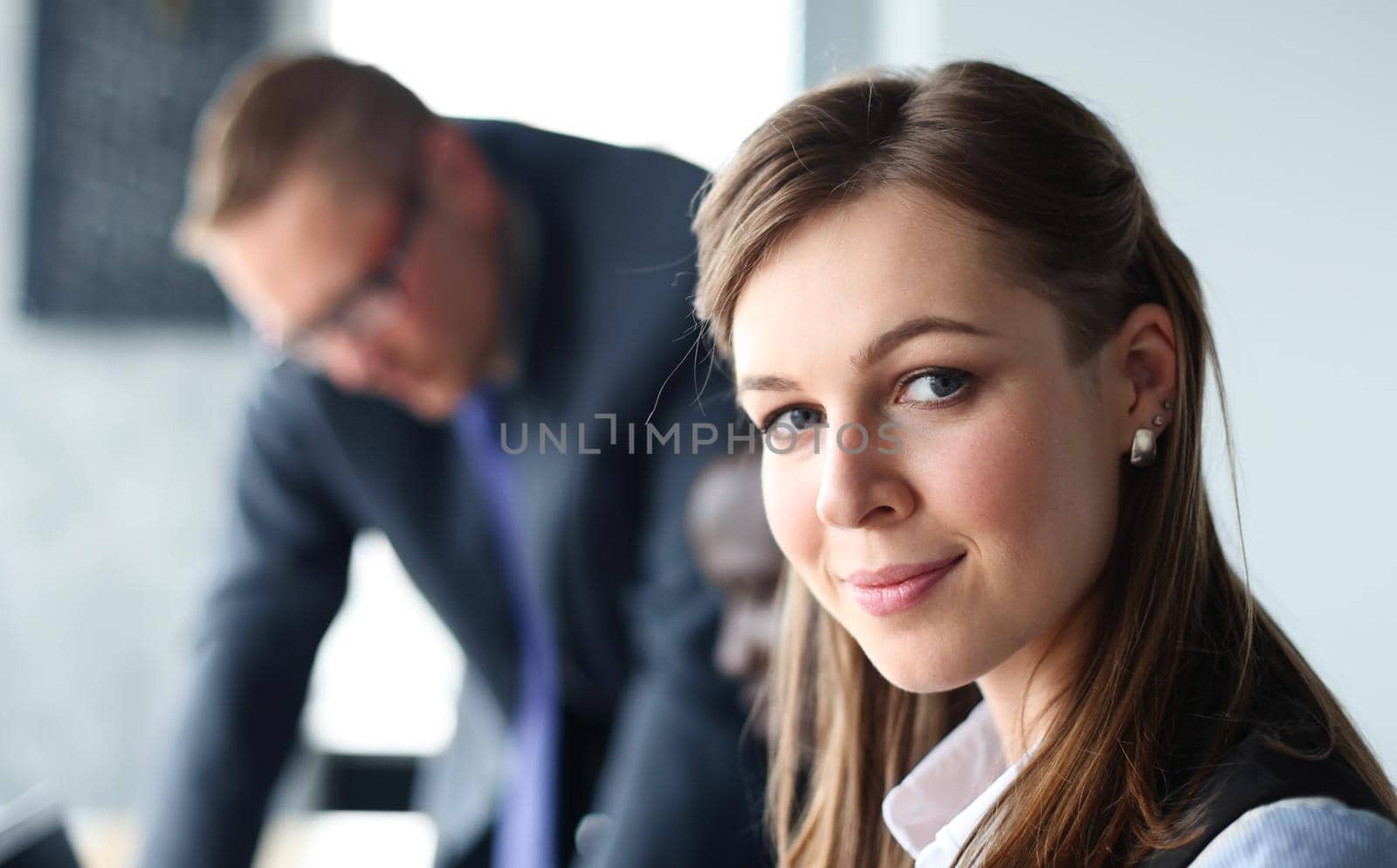 business woman with her staff, people group in background at modern bright office indoors