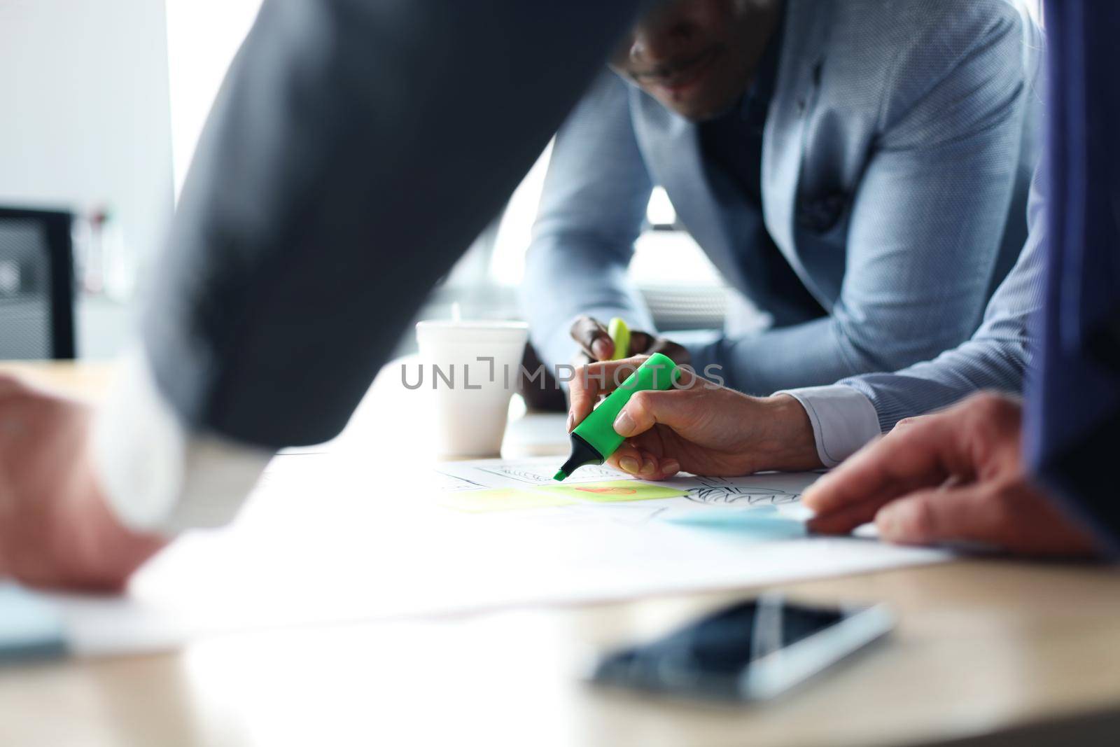 Image of business people hands working with papers at meeting by tsyhun