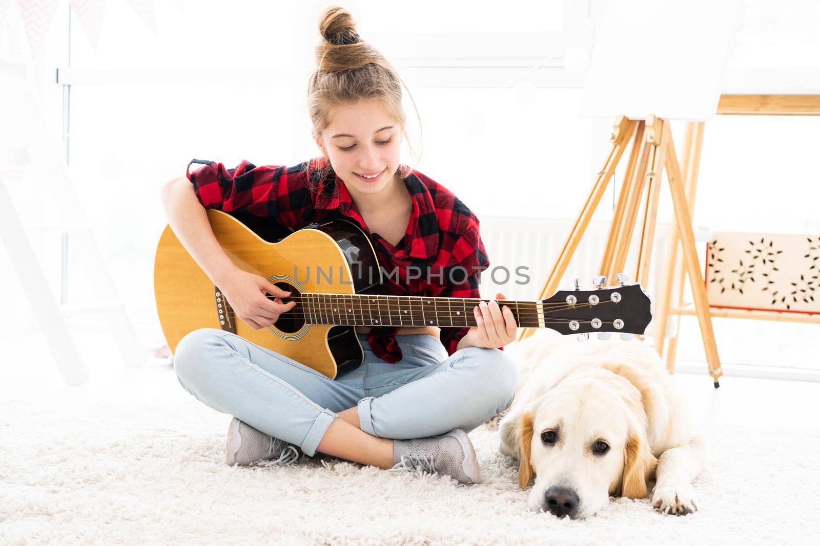 Pretty girl playing guitar to dog by GekaSkr