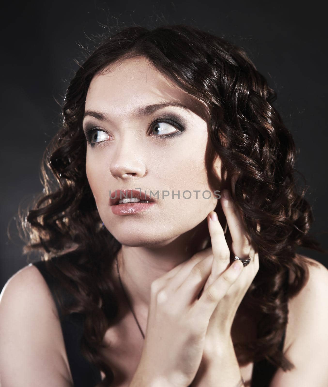 closeup portrait of a beautiful young woman. .isolated on black background