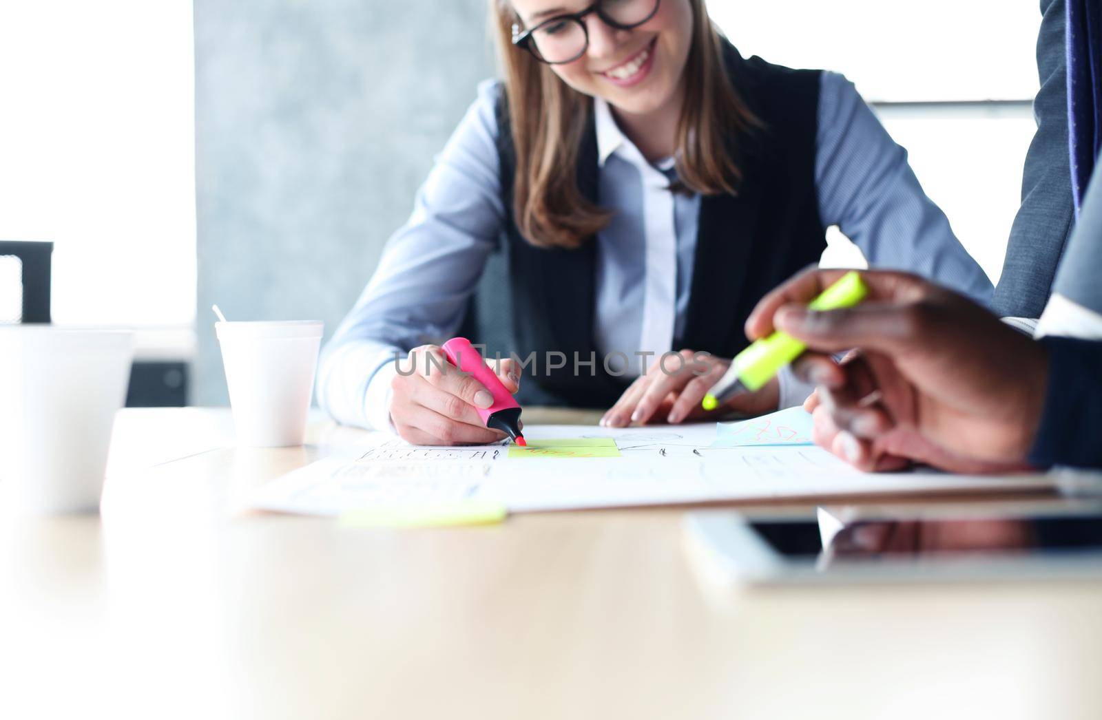 Image of business people hands working with papers at meeting by tsyhun