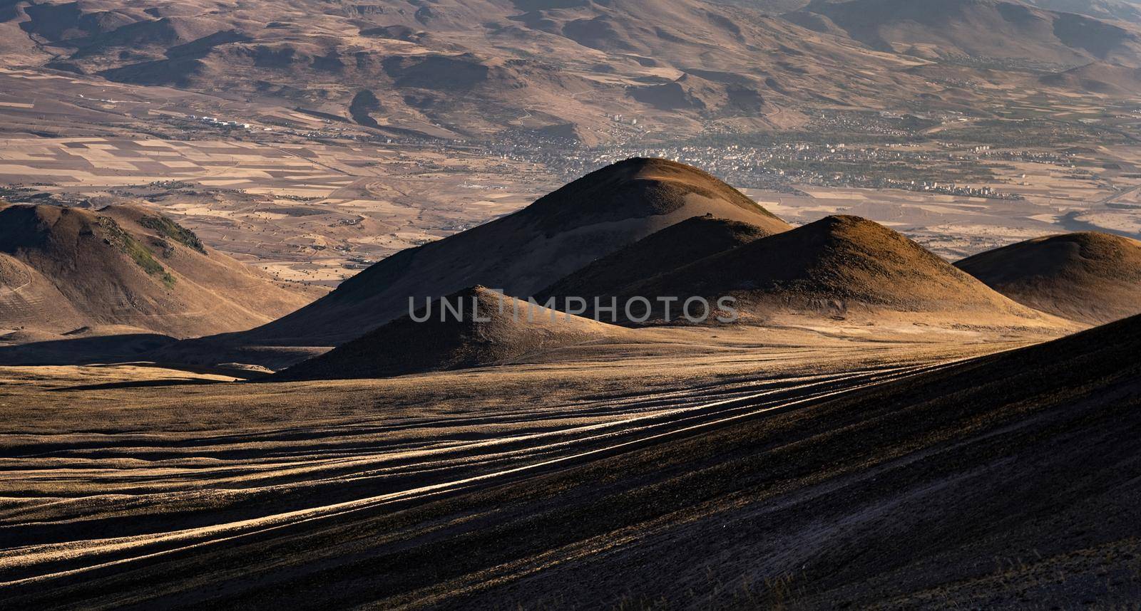 Beautifull hills of Erciyes volcano in Turkey with view from above. Scenic landscapes of mountain from the top. Amazing wild nature in sunrise time