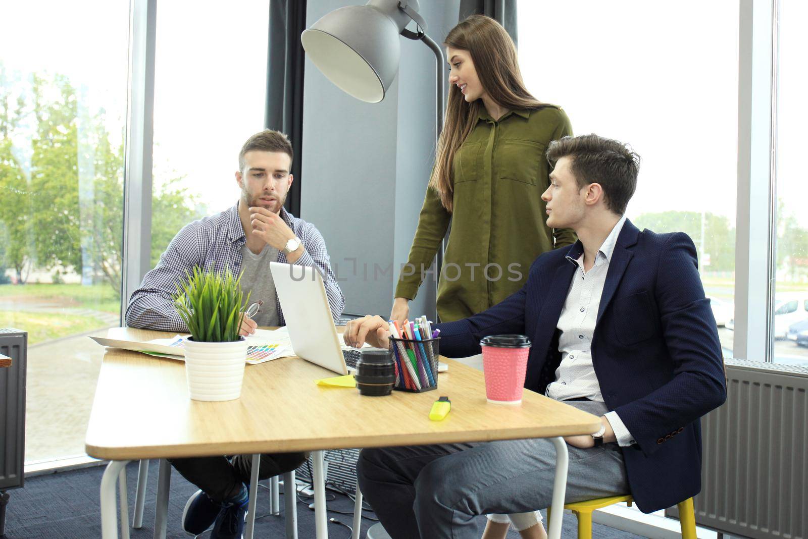 Group of young business people and designers. They working on new project. Startup concept.