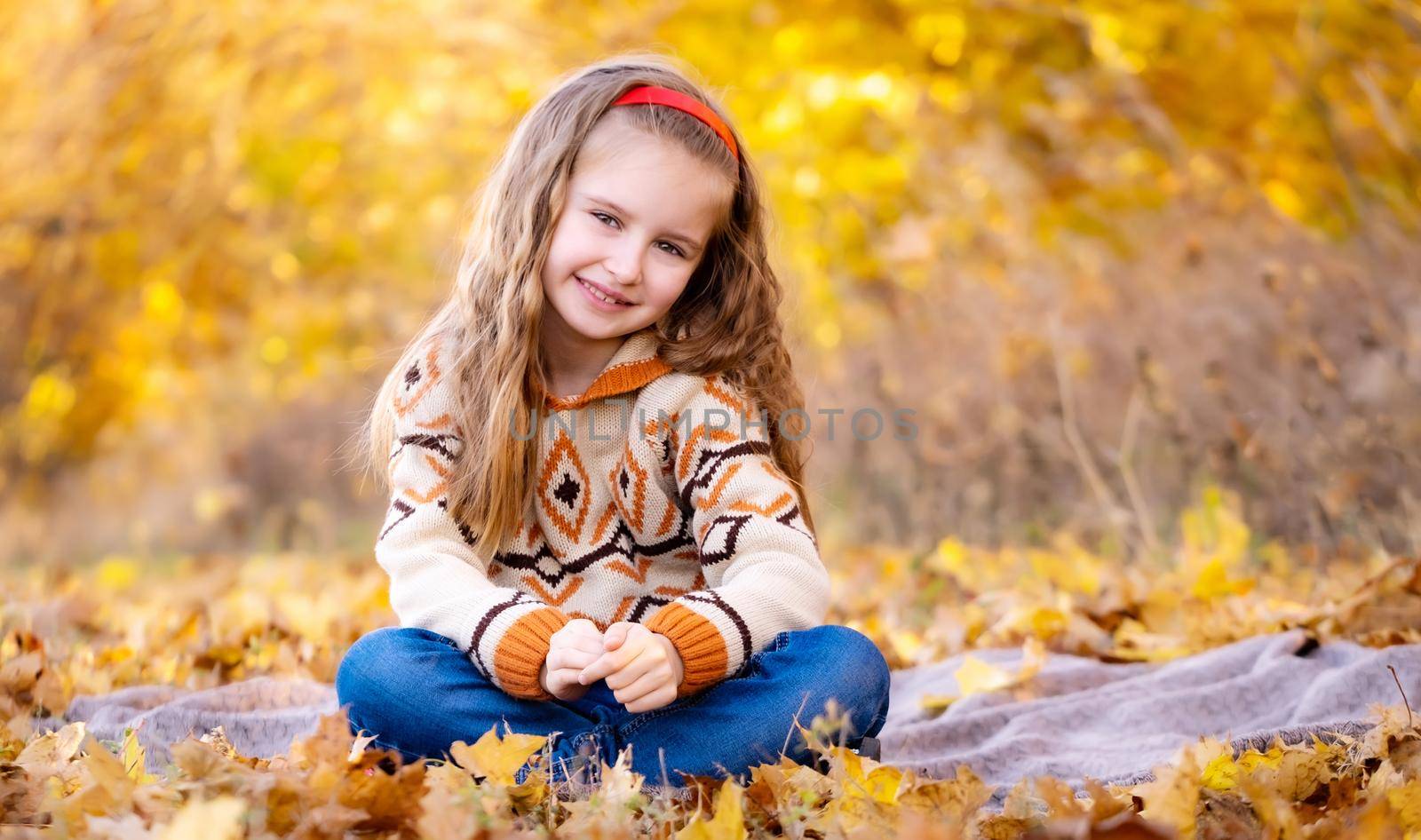 Cute little girl in autumn forest