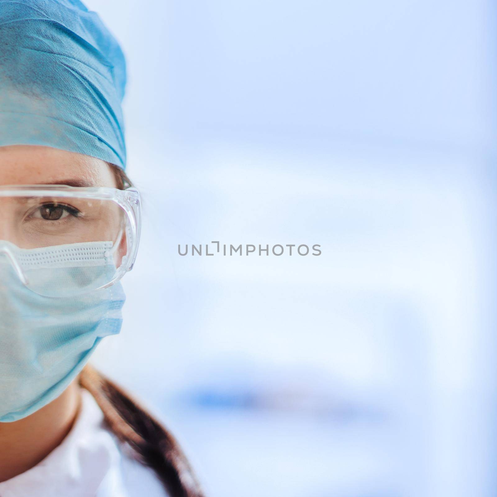 close up. portrait of a female medical scientist in a protective mask.