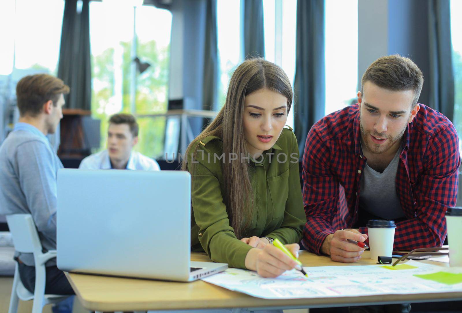 Young group of people doing their jobs on laptop.