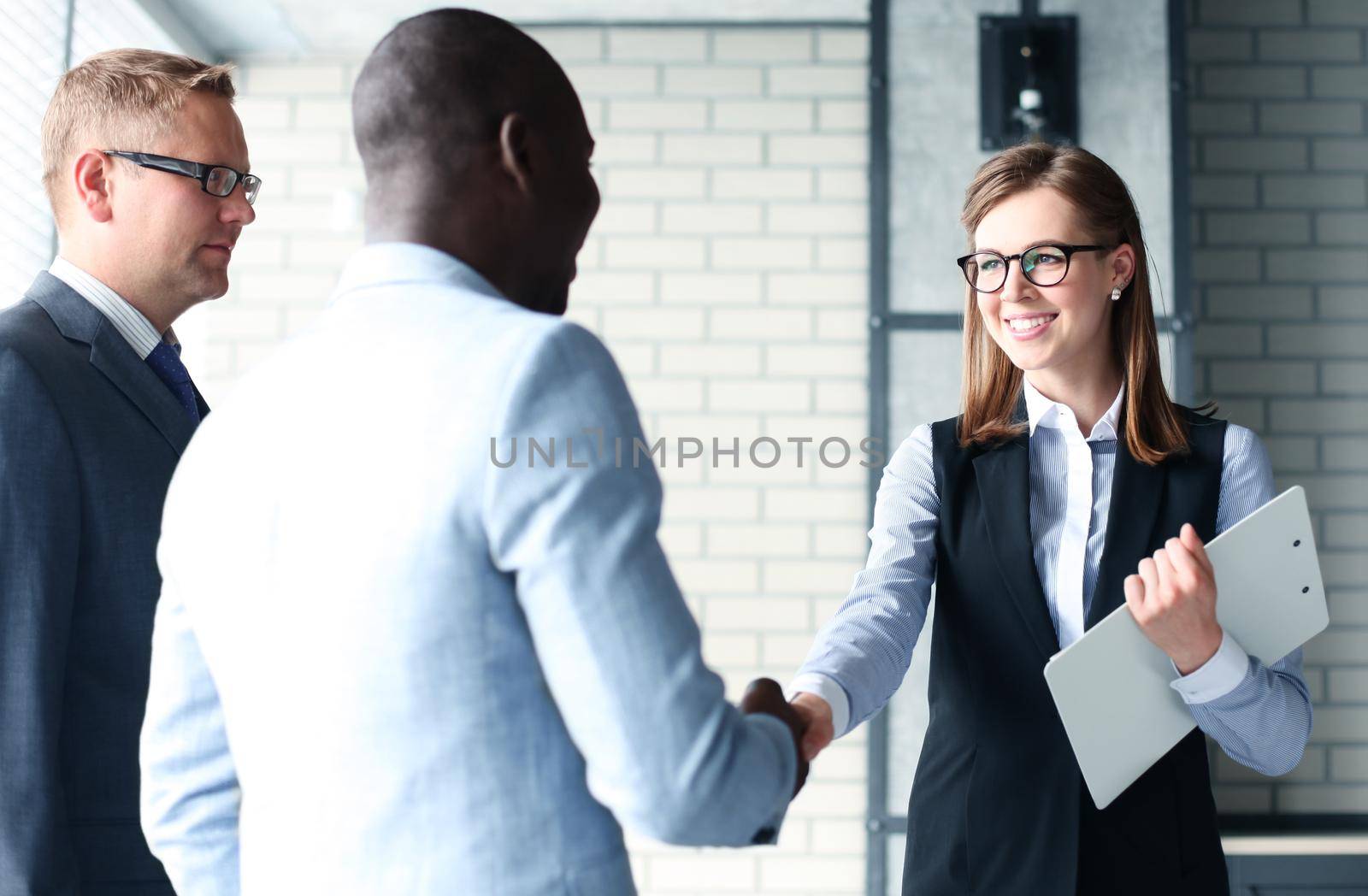 Business people shaking hands, finishing up a meeting