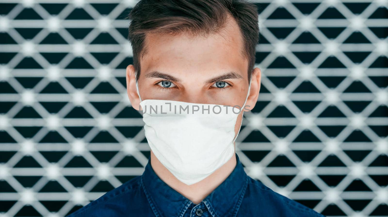 close up. a modern young man in a protective mask . concept of health protection