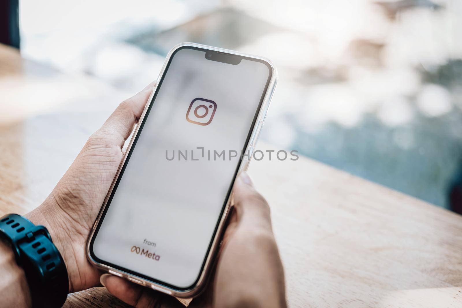 CHIANGMAI, THAILAND - Nov 07, 2021: A man holding smartphone with Instagram application on the screen. Instagram is a photo sharing app for smartphones