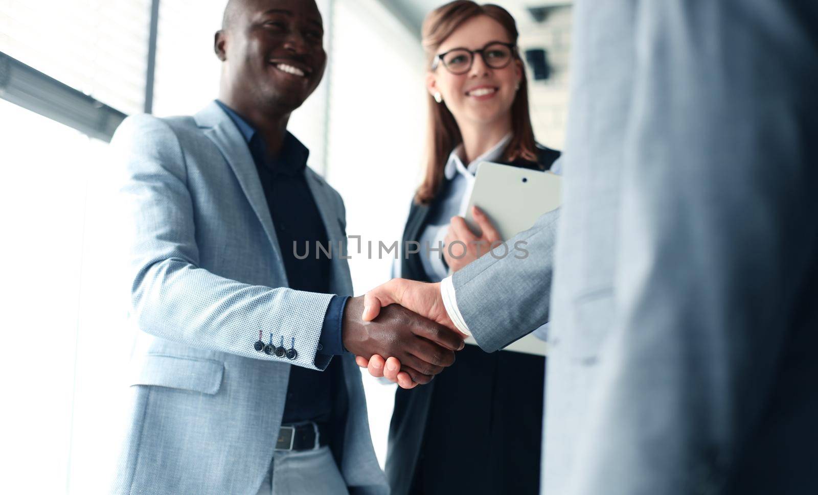 Business people shaking hands, finishing up a meeting