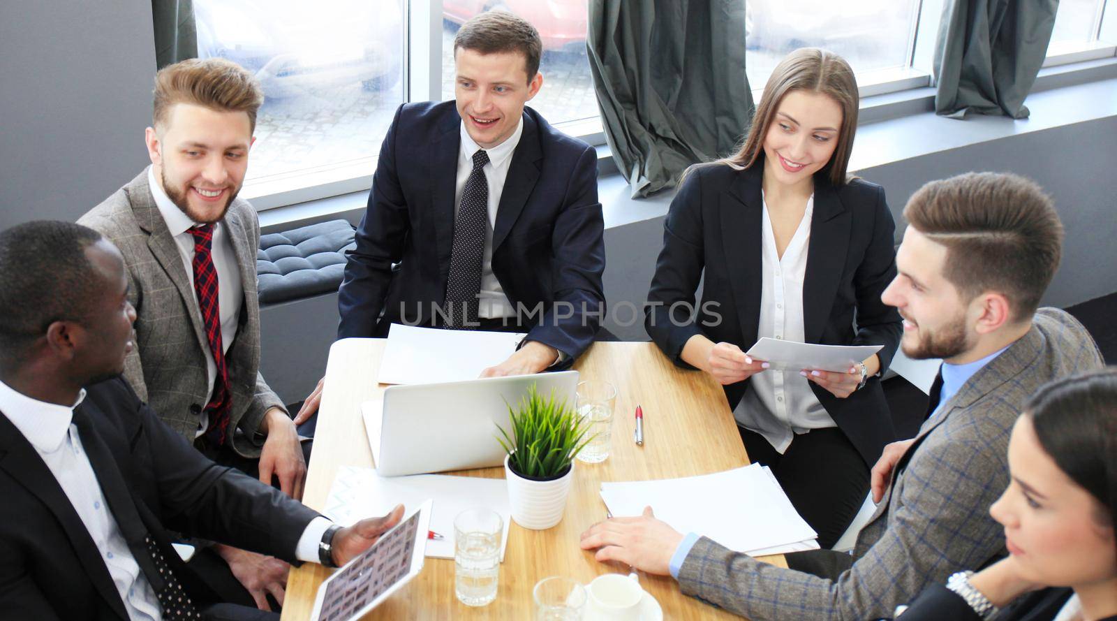 Business team discussing together business plans in office