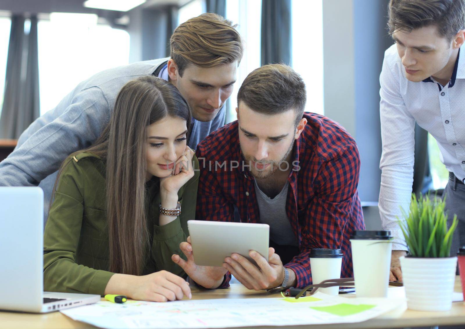 Young group of people doing their jobs on laptop.