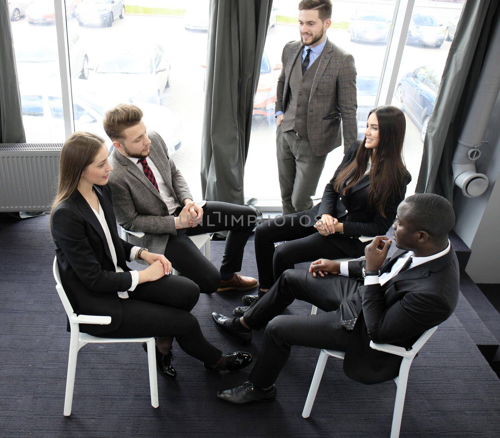 Business team discussing together business plans in office