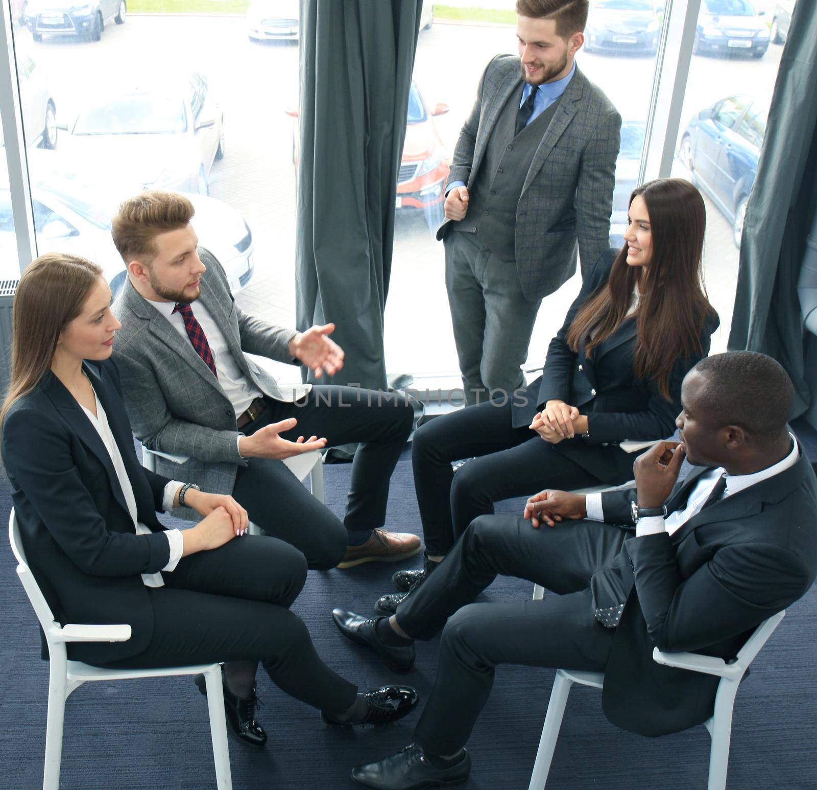 Business team discussing together business plans in office