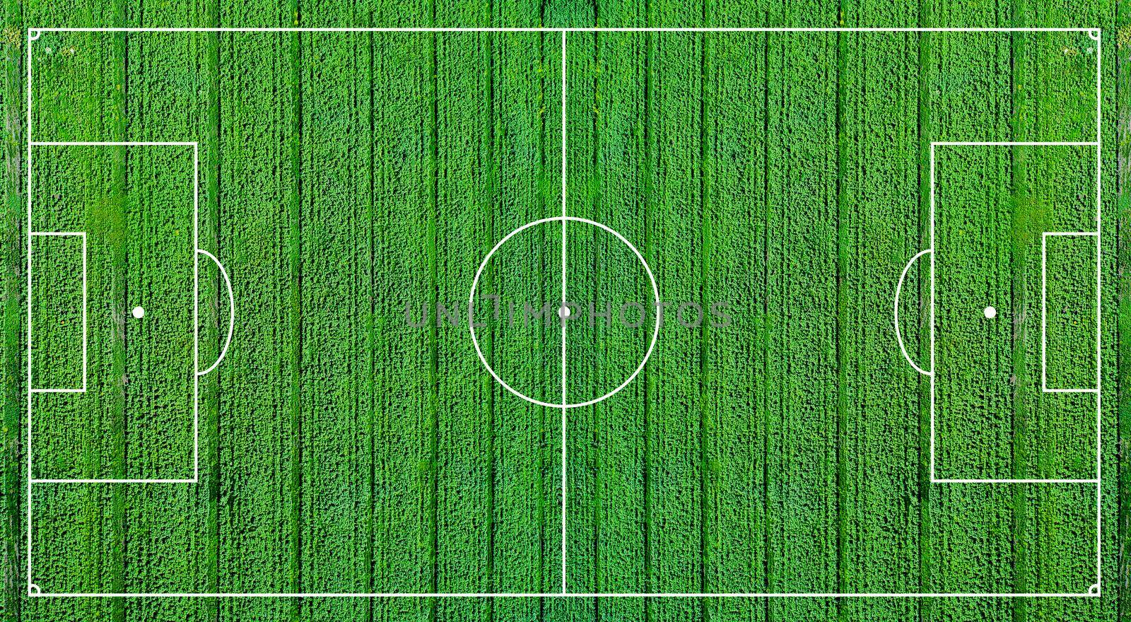 Green football field. Soccer field illustration pattern. Light green grass realistic background top view.