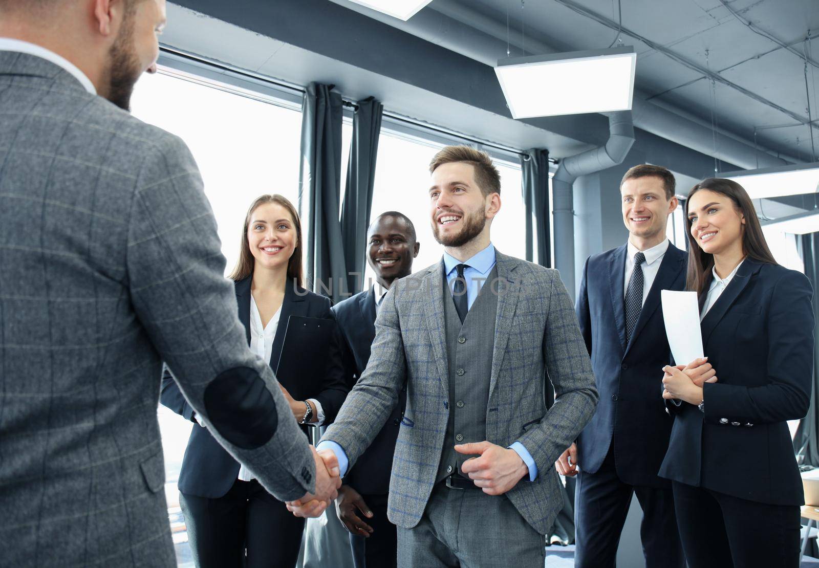 Business people shaking hands, finishing up a meeting