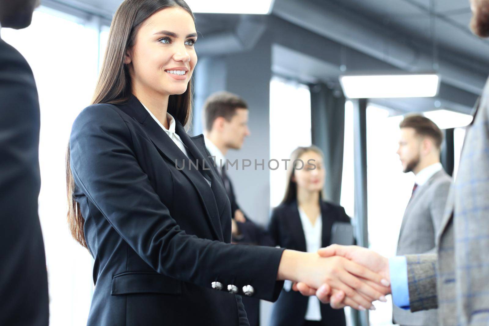 Business people shaking hands, finishing up a meeting
