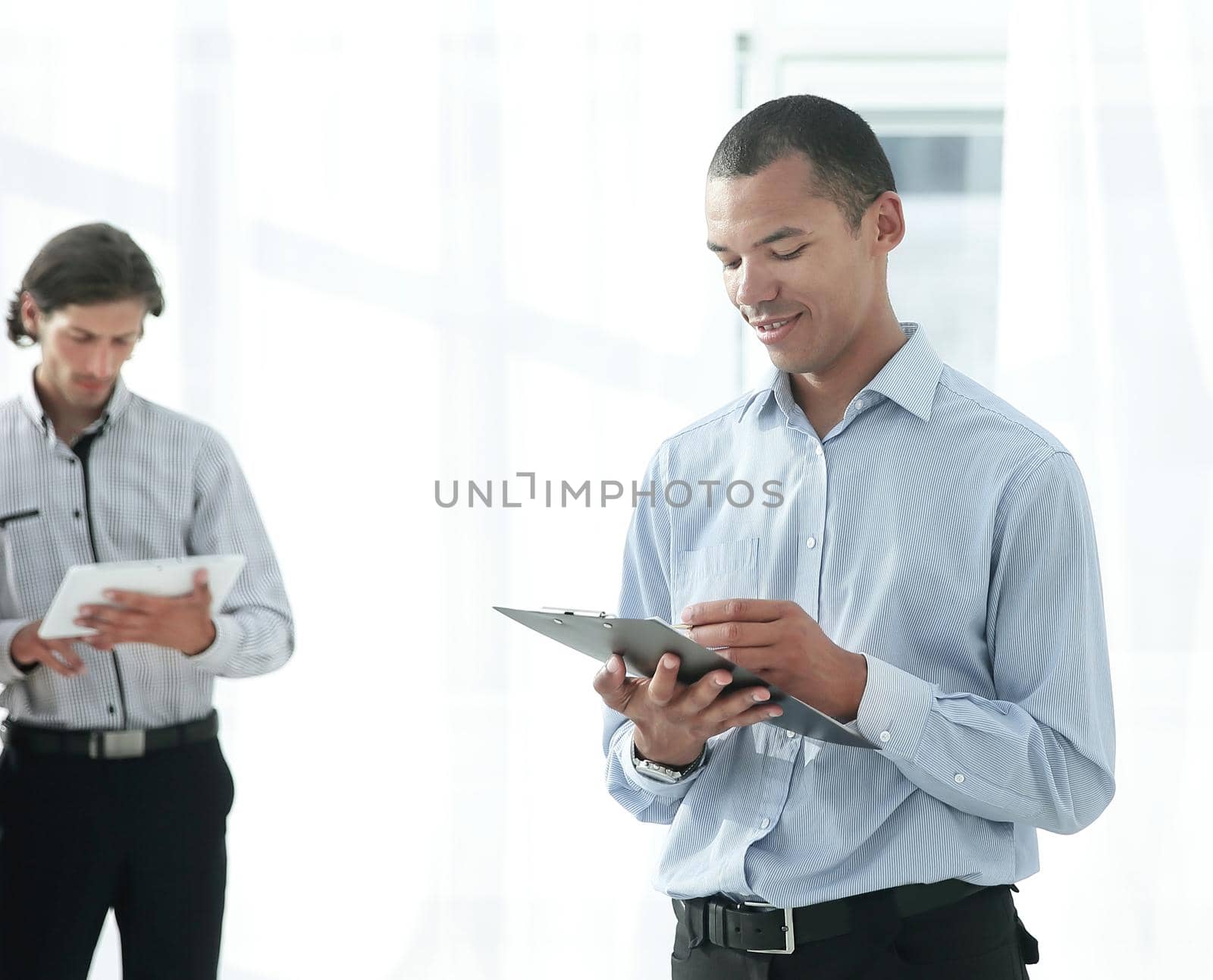 employees of the company before the meeting, standing in the lobby of the office.photo with copy space