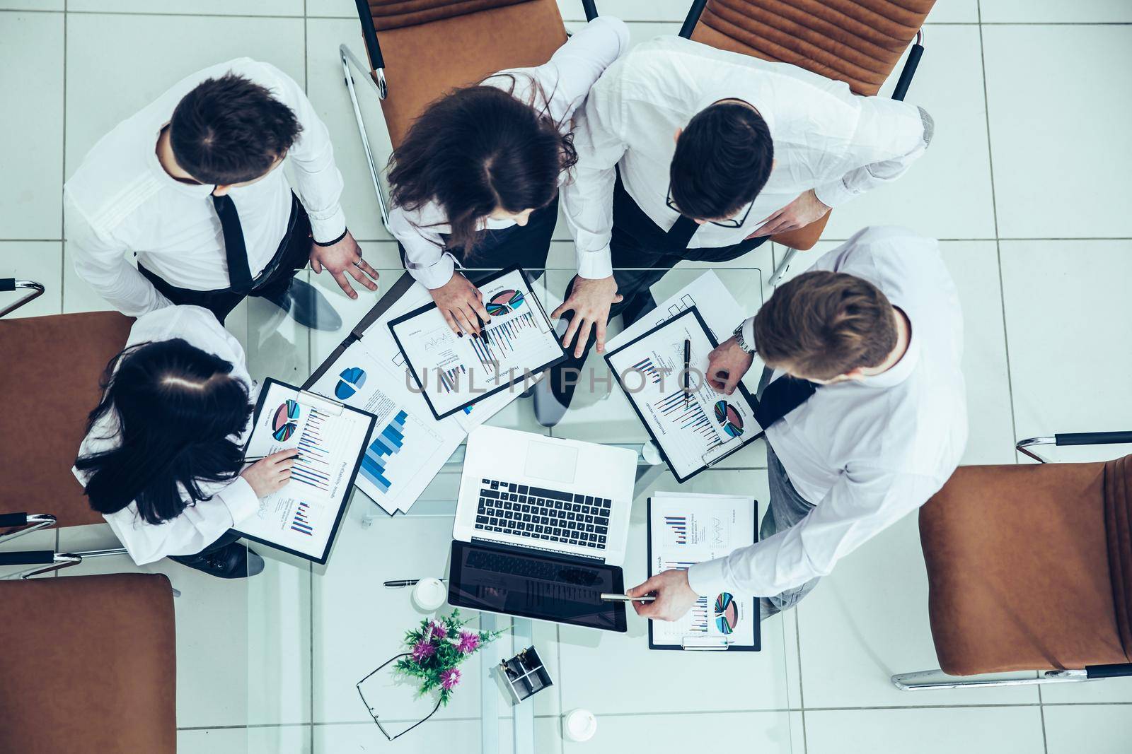 top view of business team discussing the company's financial plan for the modern workplace