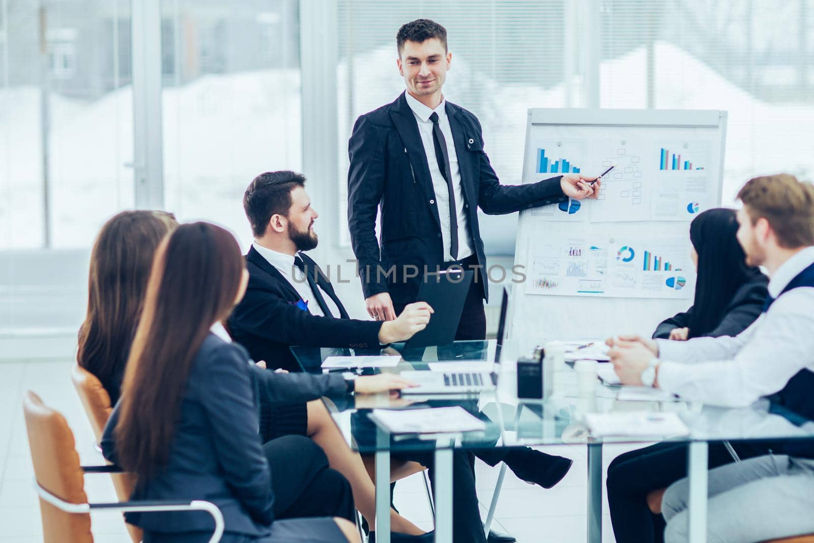 business team gives a presentation of a new financial project for the business partners of the company . the photo has a empty space for your text.