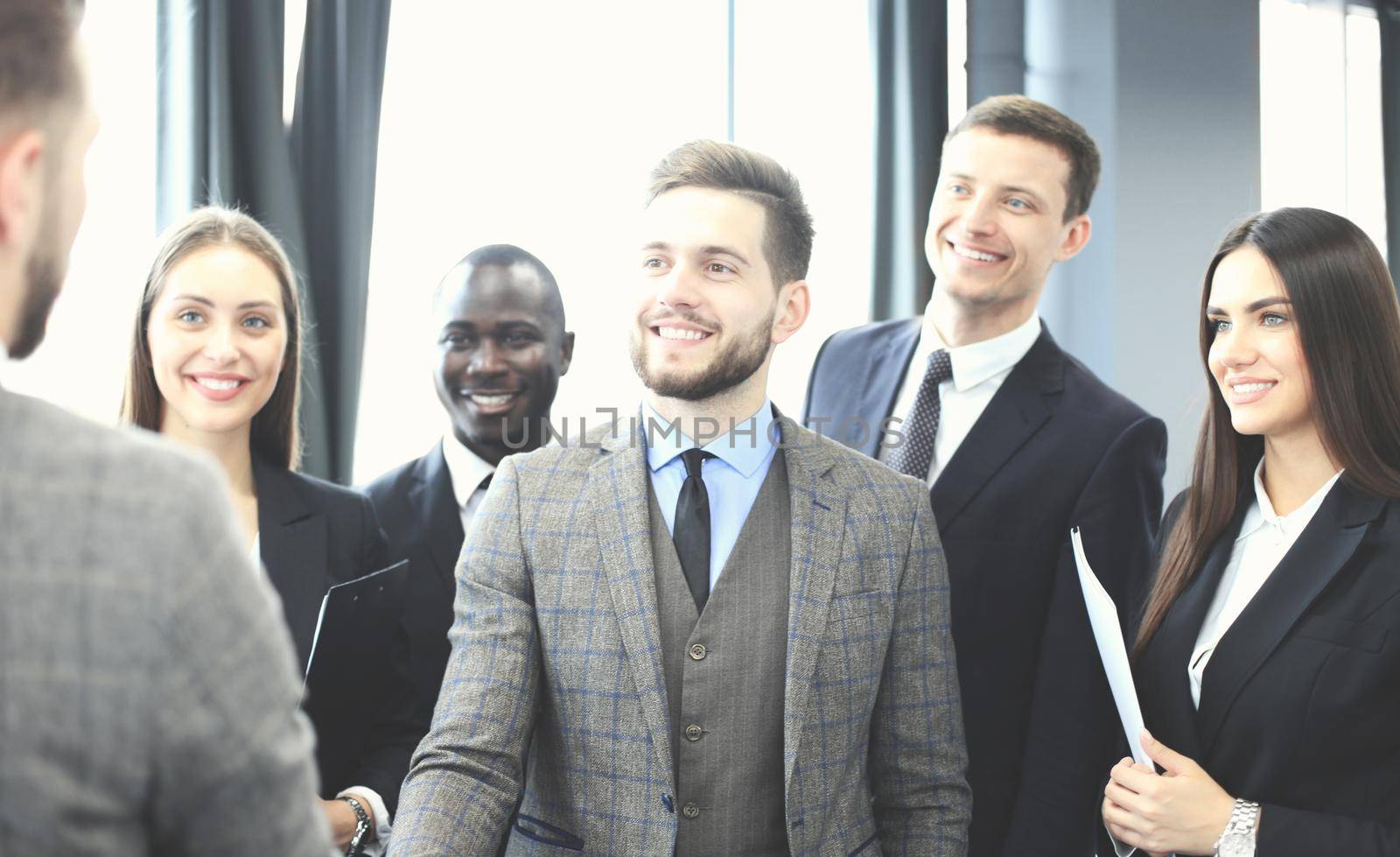 Business people shaking hands, finishing up a meeting