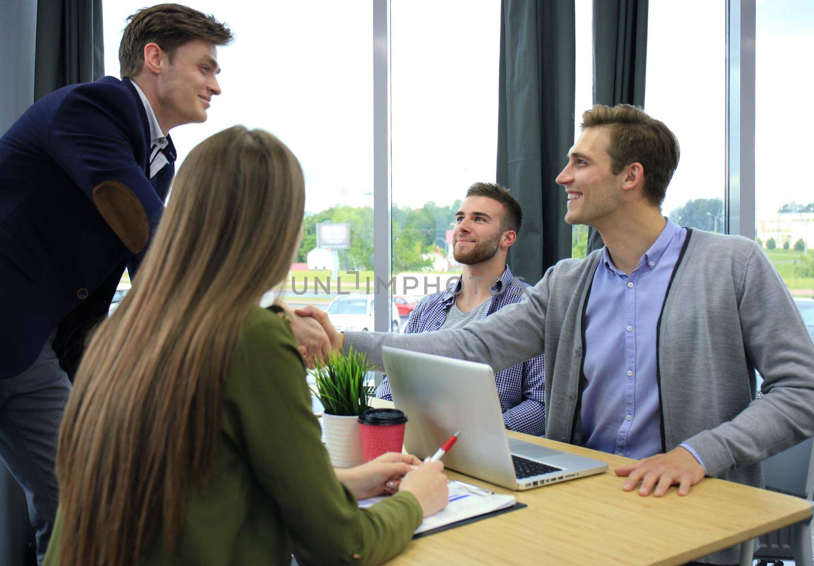 Job applicant having interview. Handshake while job interviewing.