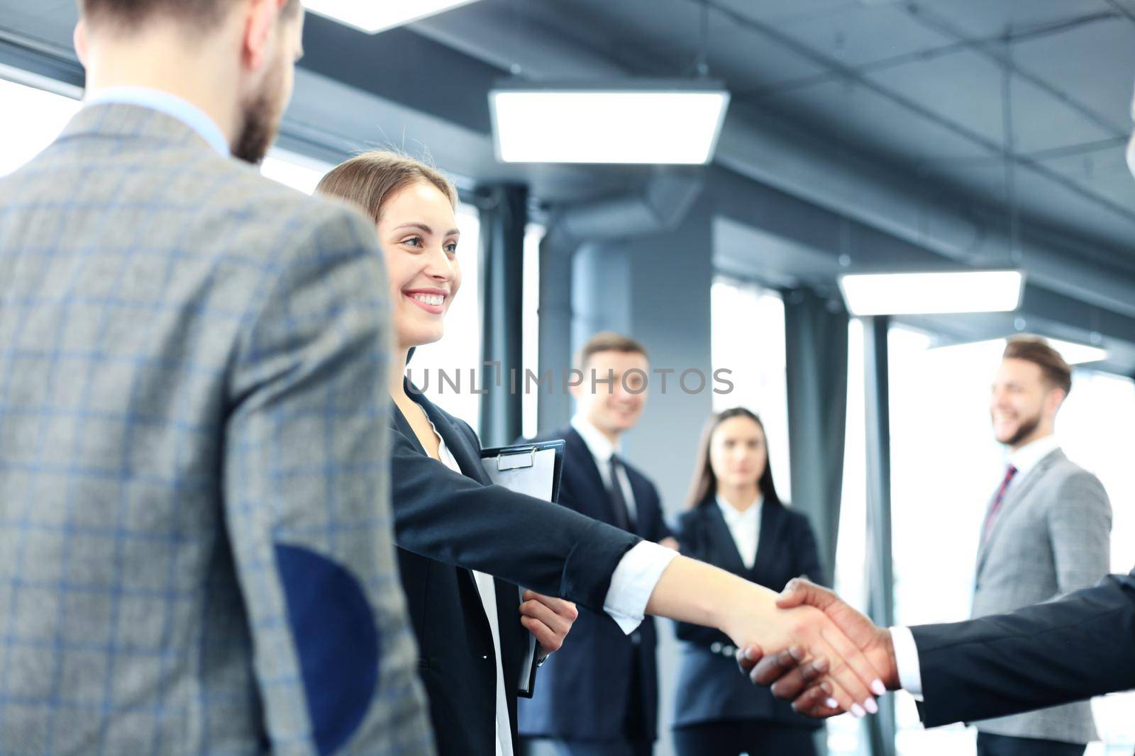 Business people shaking hands, finishing up a meeting