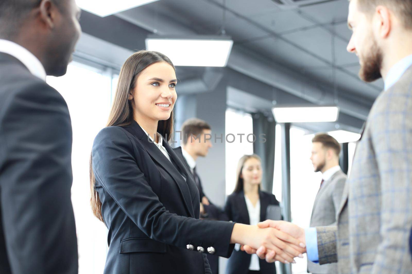 Business people shaking hands, finishing up a meeting