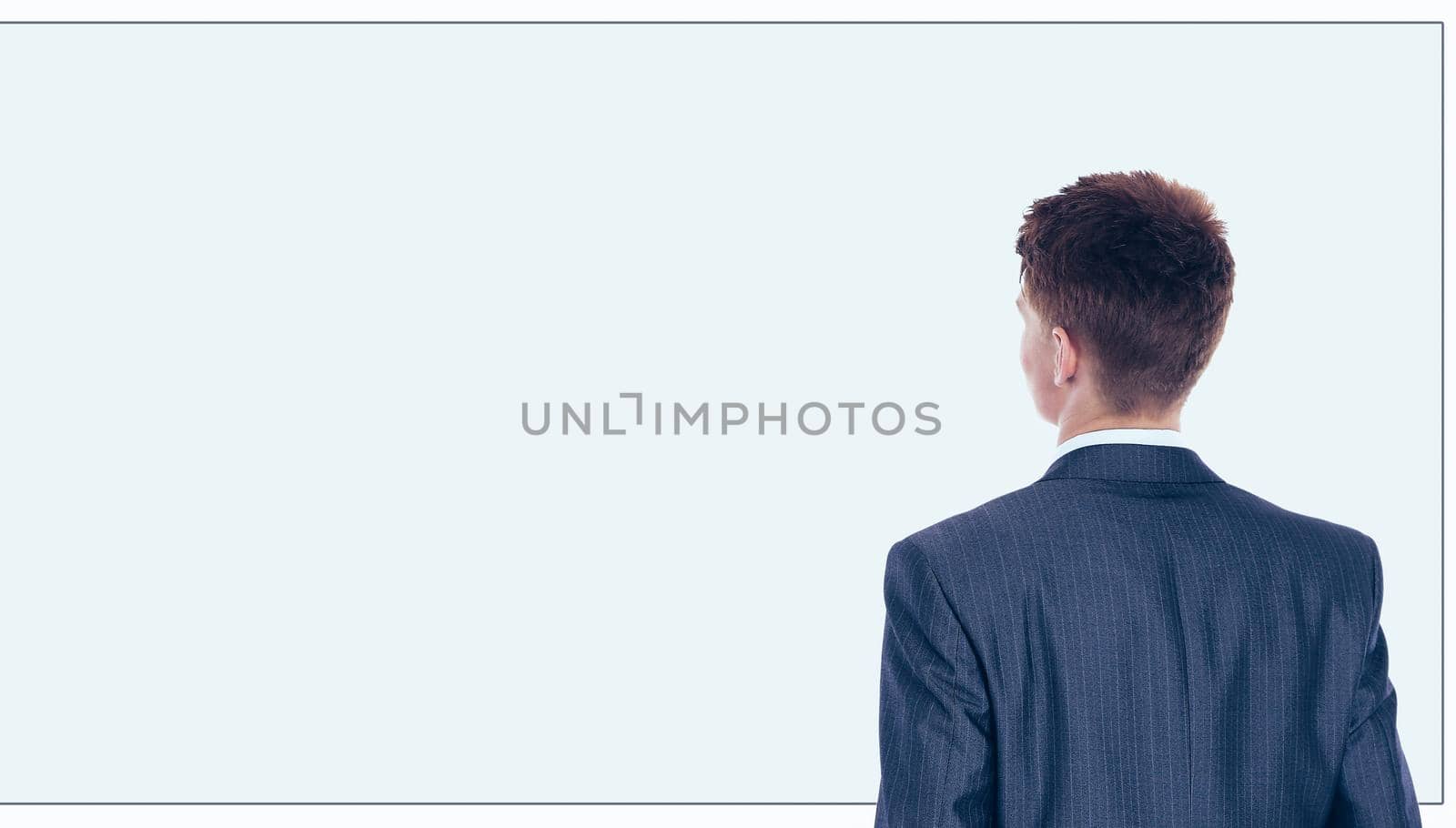 The young handsome businessman isolated on a white background.