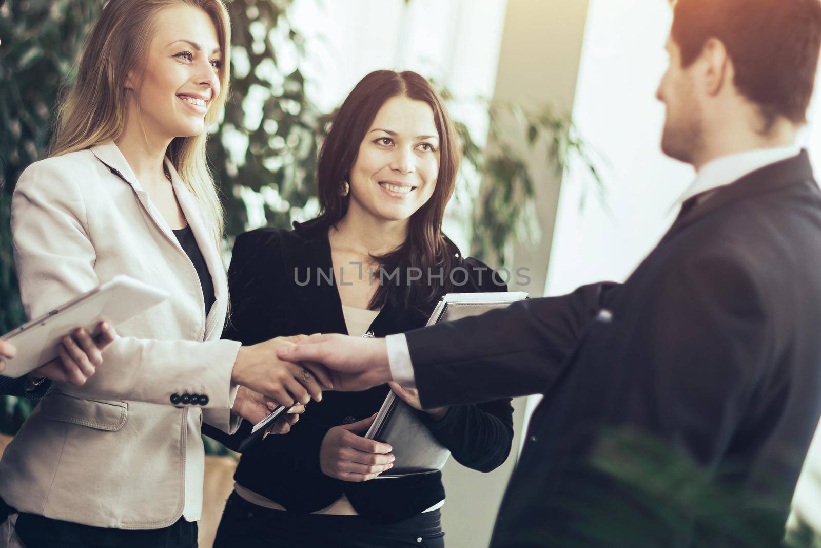 Conference of entrepreneurs. Deals with a handshake in the office