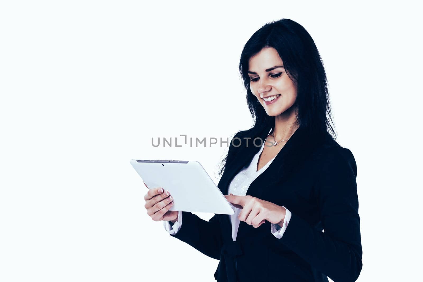 Young, attractive, successful business woman studying a business plan on the tablet on a white background