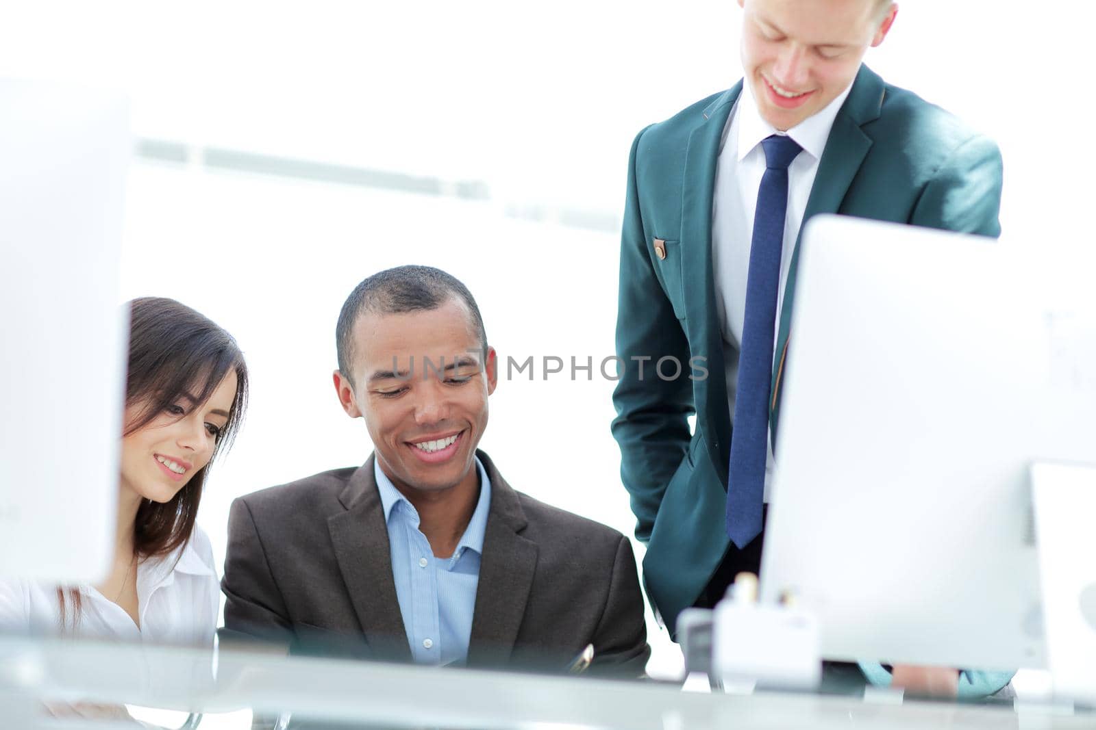 project Manager and business team discussing work documents in the office
