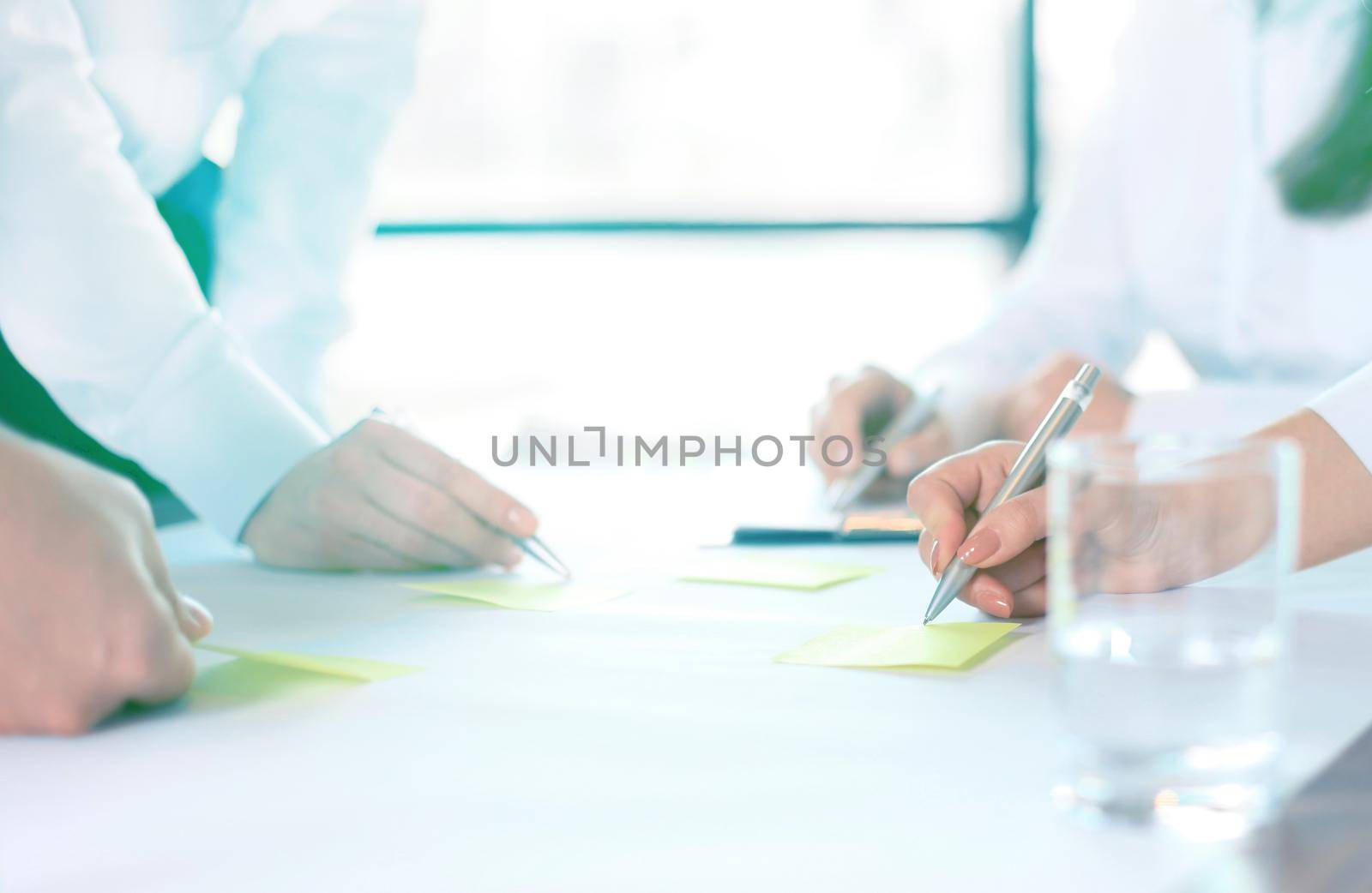 Image of business people hands working with papers at meeting by tsyhun