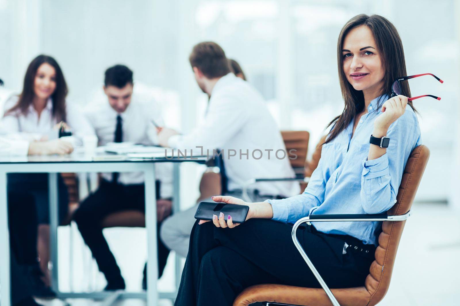 leading lawyer of the company on background, business meeting business partners. the photo has a empty space for your text.