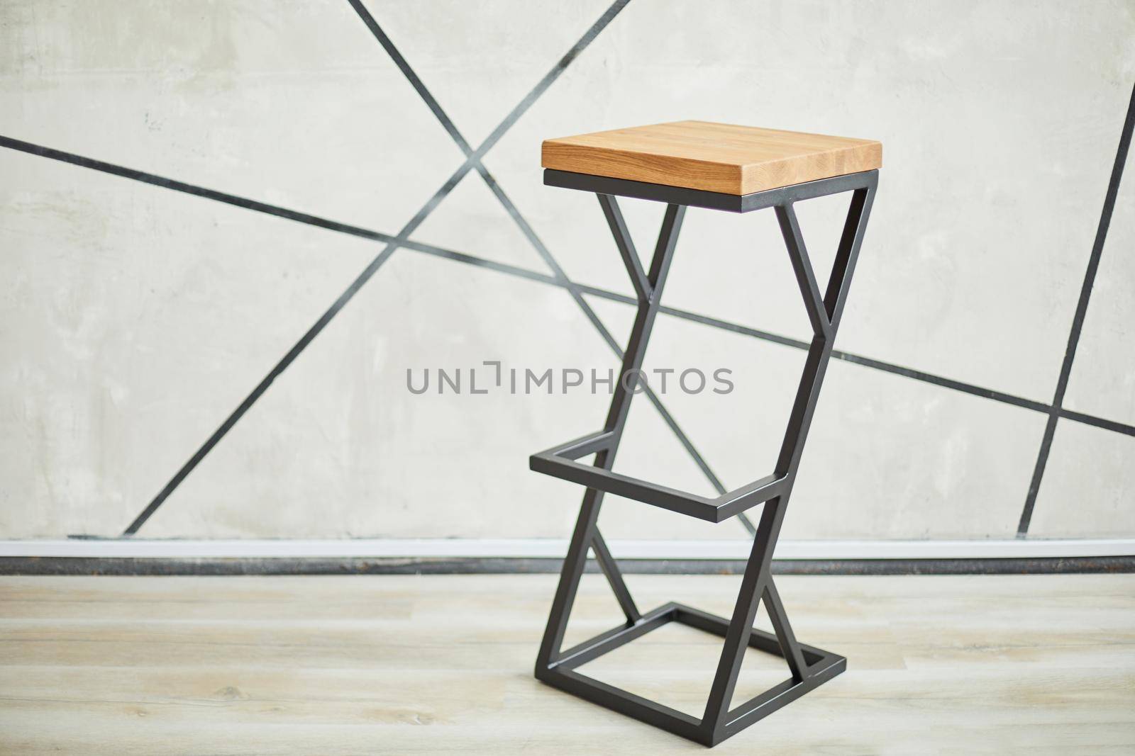 high bar stool made of wood and metal. photo with copy space