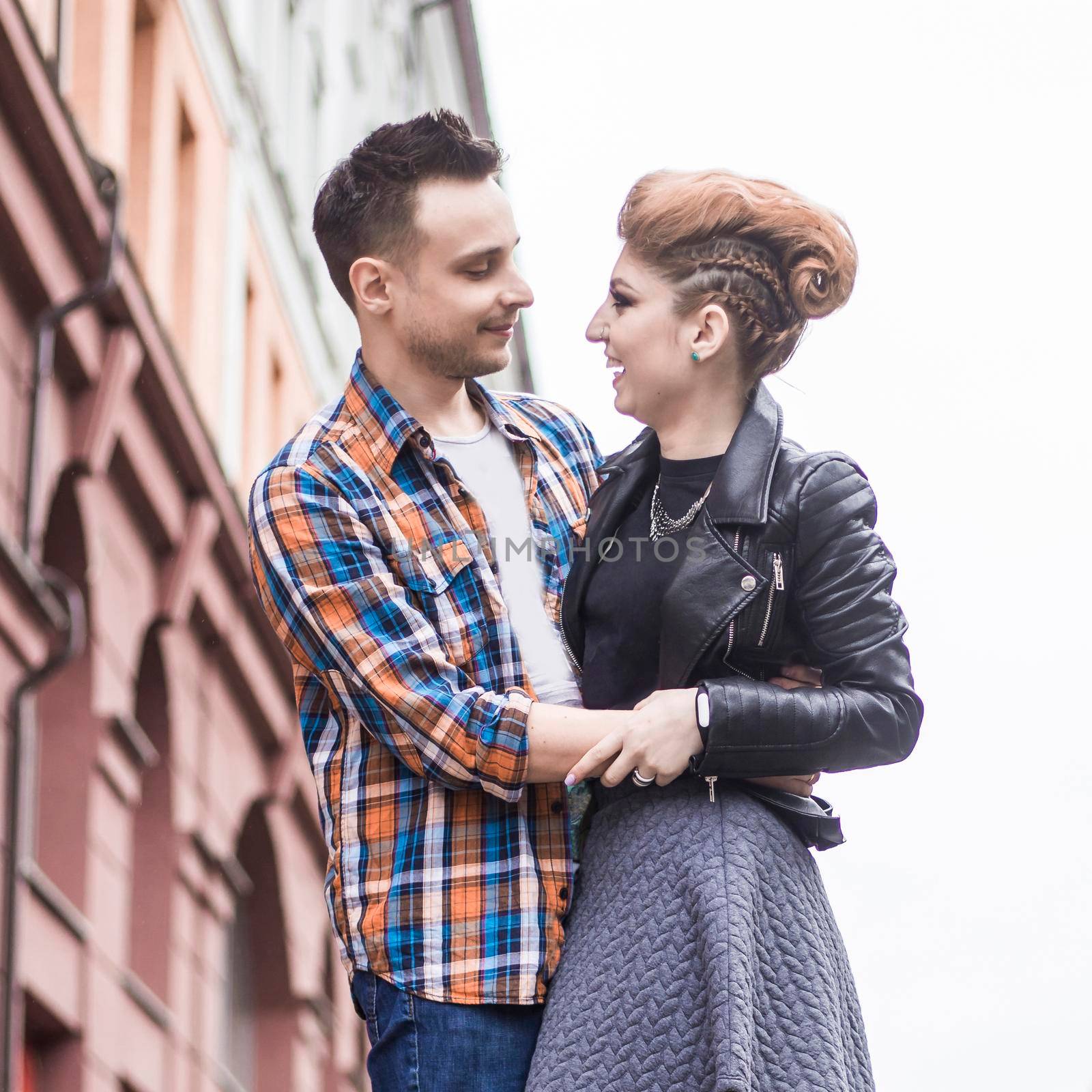 happy lovers hugging when meeting on the street by SmartPhotoLab