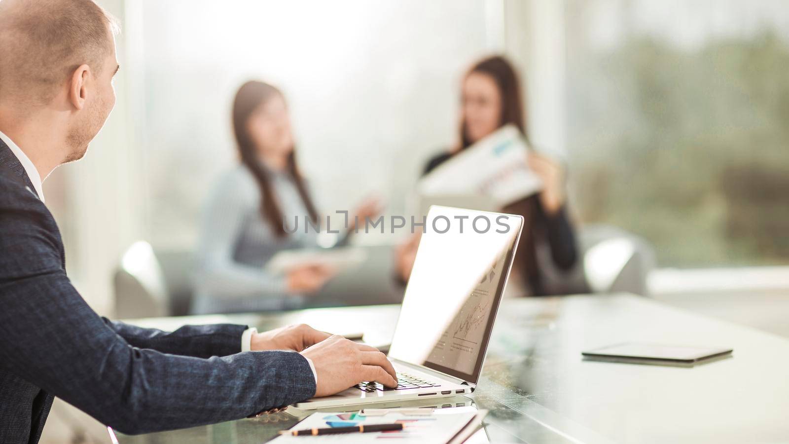 closeup - financial managers working on laptop with financial data at the workplace in a modern office.