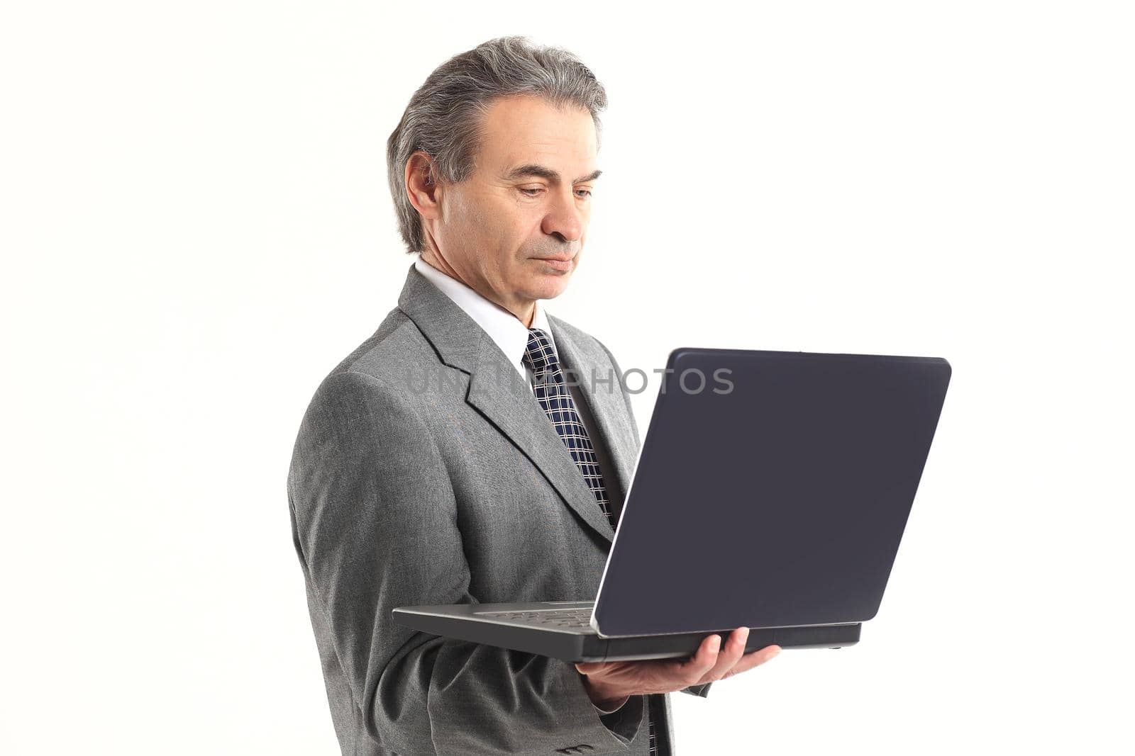 close up.adult businessman looking at laptop screen.isolated on white background.