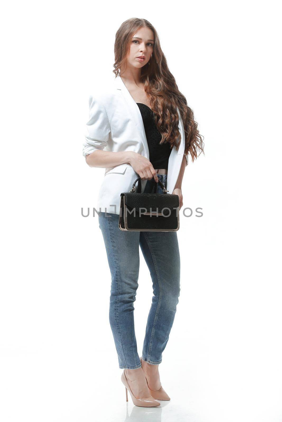 side view.full-length portrait of smiling young woman .isolated on white.