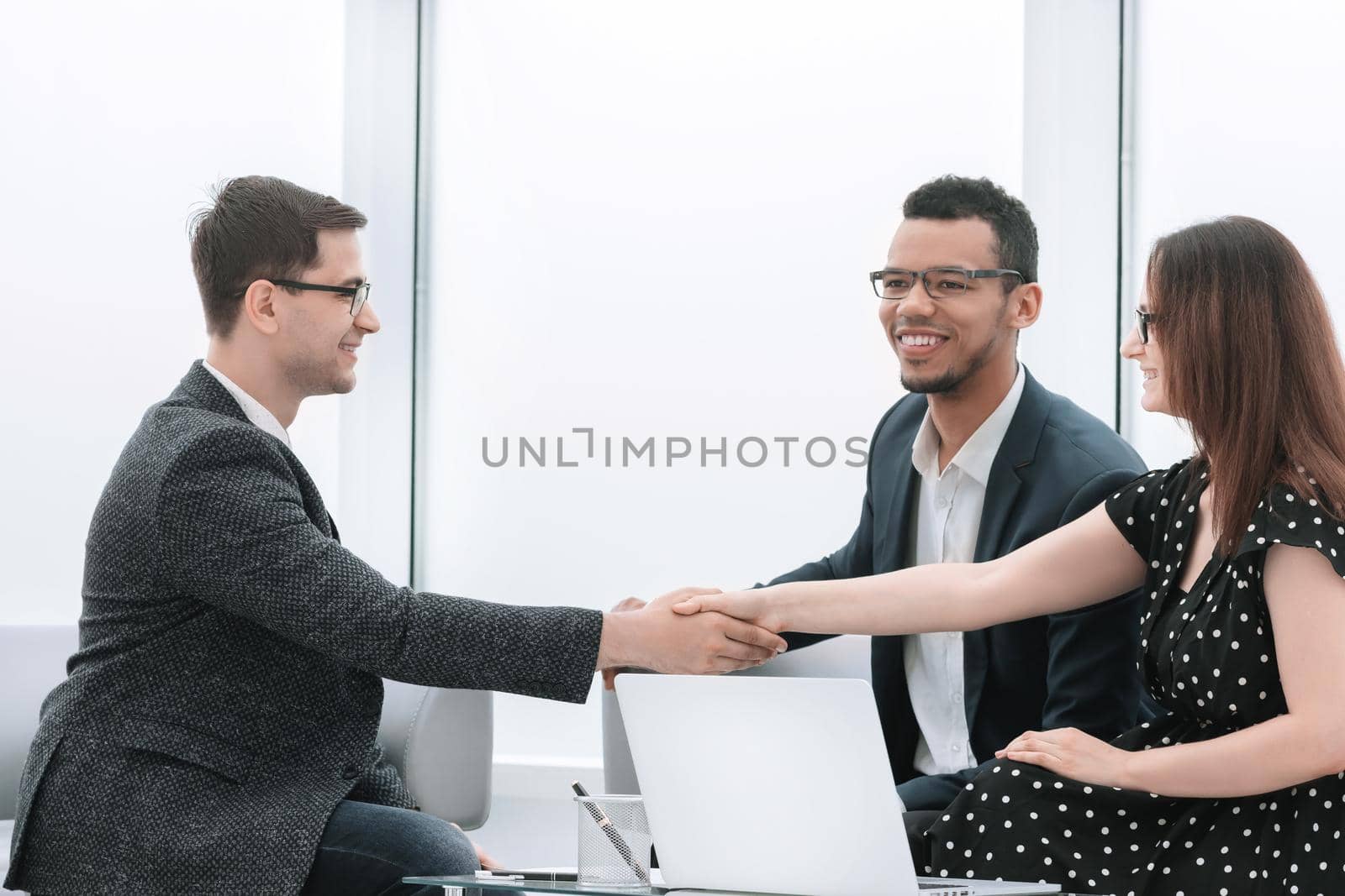 handshake of business partners after discussing a new joint project. concept of cooperation