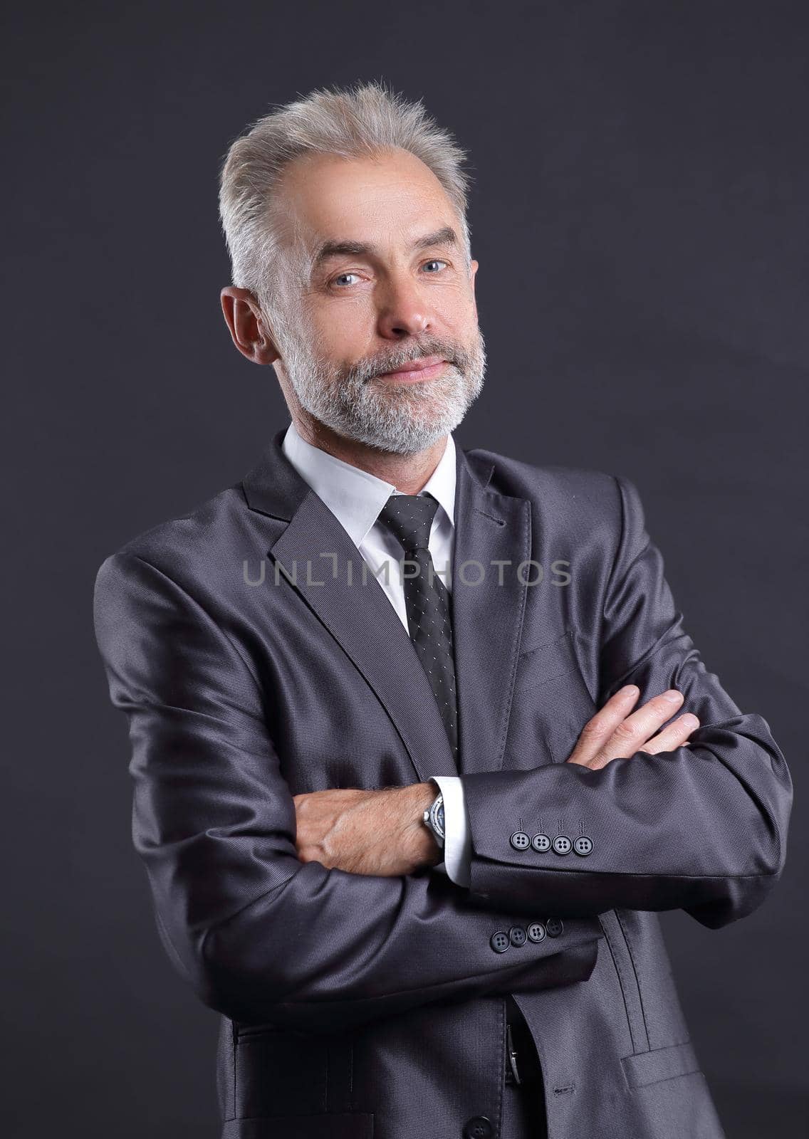 portrait of a senior businessman.isolated on dark background.