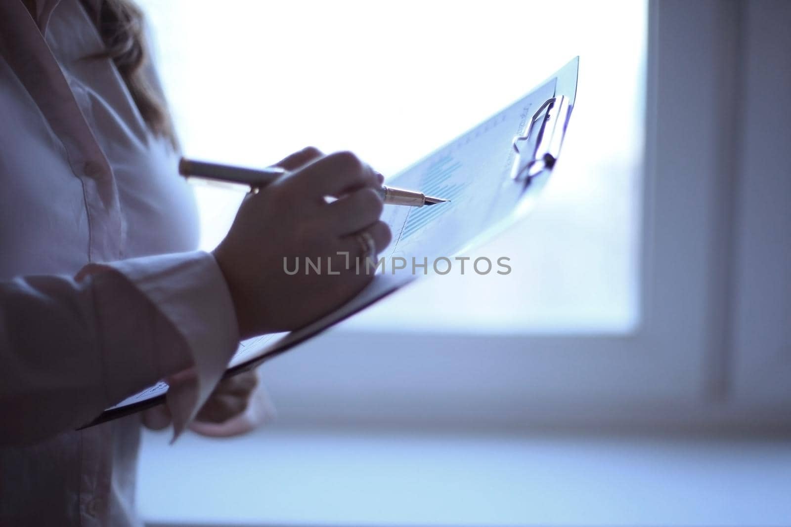 close up. business woman checking financial data.photo with copy space