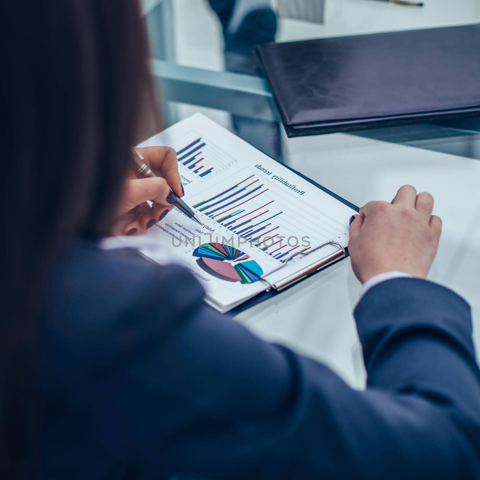 closeup of business team discussing financial charts on a workplace in a modern office