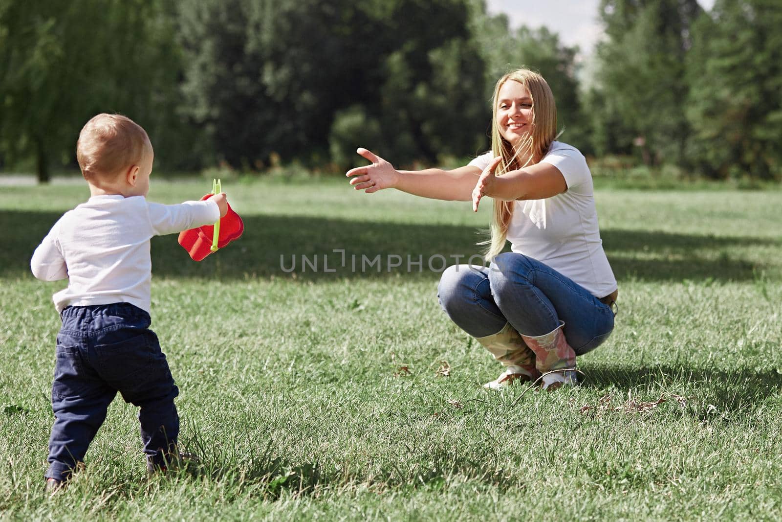 mommy and her little son are having fun outdoors. the concept of active recreation