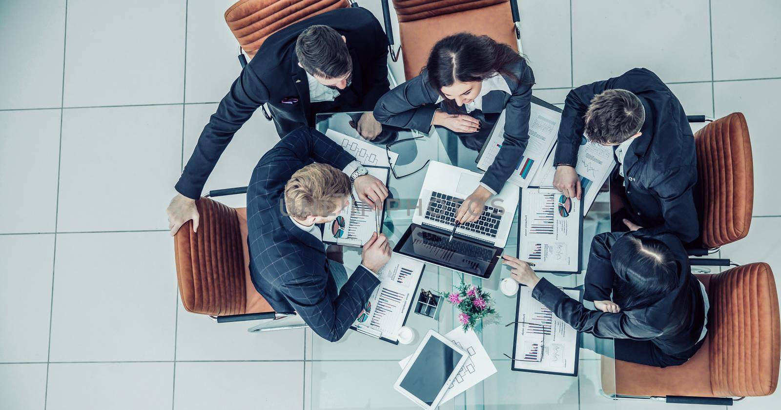 top view of successful business team working on a financial report on the company's profits.the photo has a empty space for your text