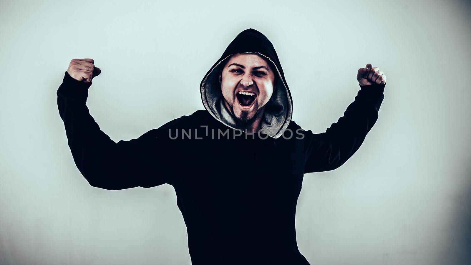 energetic guy rapper on a light background.the photo has a empty space for your text